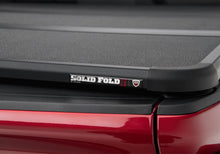 Load image into Gallery viewer, Extang 83458 Solid Fold 2.0 - 19(NewBody)-25 Silv/Sierra1500 8'2" w/o SideStrgBxs w/o CrbnPro for Select Chevrolet Silverado 1500, GMC Sierra
