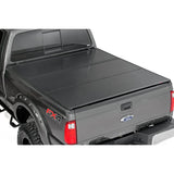 Rough Country 45599650 Ford Hard Tri-Fold Bed Cover 99-16 F-250/350-6.5 Foot Bed w/o Cargo Mgmt
