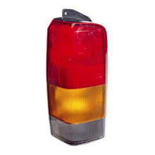 Load image into Gallery viewer, Omix-Left-Tail-Lamp-97-01-Jeep-Cherokee-(Xj)