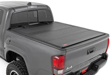 Load image into Gallery viewer, Rough Country 49415500 Hard Tri-Fold Tonneau Bed Cover for Select Toyota Tacoma