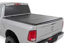 Load image into Gallery viewer, Rough Country 49319550 Hard Tri-Fold Tonneau Bed Cover for Select Dodge Ram 1500, Ram 1500, Ram Classic